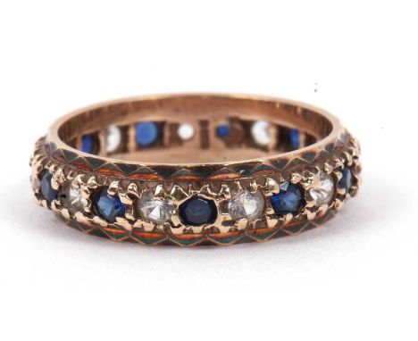 A 9ct gold full eternity ring alternate set with blue and white small stones, size L/M