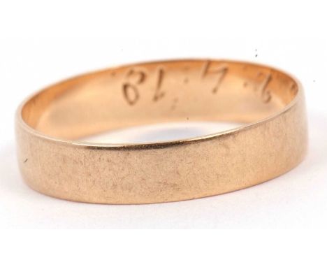 Yellow metal wedding ring of plain polished design engraved inside with a D.B 2.4.18, tests 9ct gold, 2.2 gms, size S/T