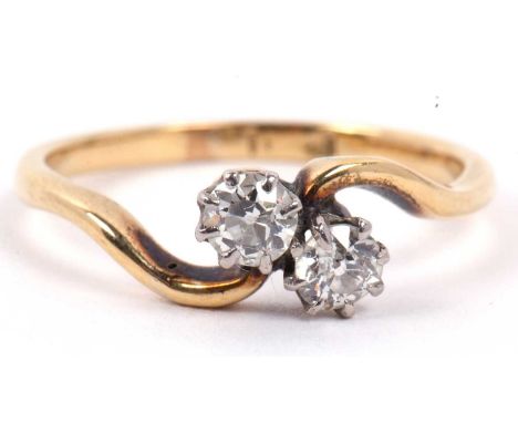 A two stone diamond crossover ring featuring two round brilliant cut diamonds, 0.30ct total approx, re-sized for M