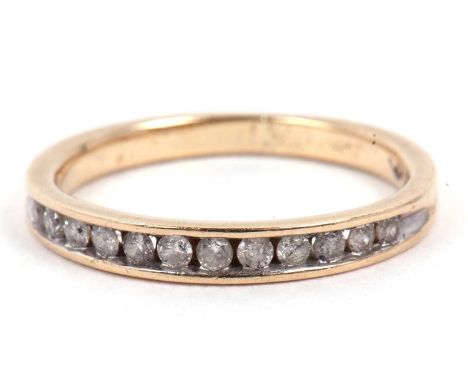 Modern diamond half eternity ring chanel set with twelve small round single cut diamonds and stamped 10k, size K