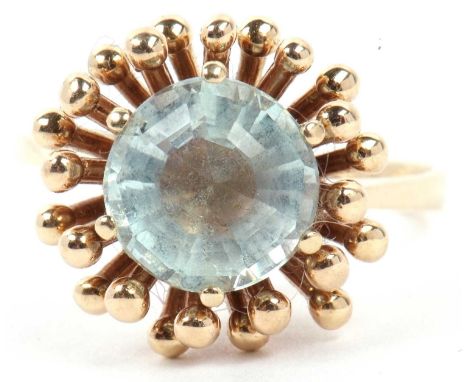 Pale aquamarine single stone ring, multi faceted and raised between a prong and bead setting, stamped 585, size Q