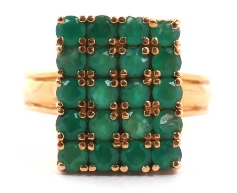 Emerald tablet ring, the rectangular panel is 16 x 12 mm, set with twenty small round cut emeralds raised above threaded shou