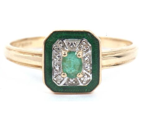 14ct gold emerald, diamond and enamel ring, the shaped rectangular panel centering an oval cut faceted emerald raised above a