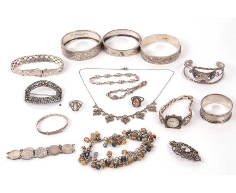 Mixed lot to include two hallmarked silver hinged bracelets, a silver serviette ring, brooches, necklaces etc