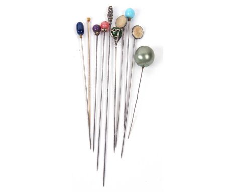 A group of ten various hat pins to include a 9ct ball finial example an Art Nouveau silver pin, makers mark for Charles Horne