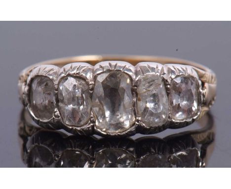 Antique old brilliant cut diamond five stone ring featurning five graduated oblong shaped diamonds, all in an enclosed settin