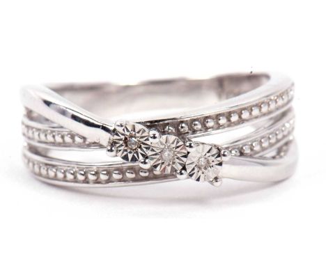 A modern white metal triple band ring highlighted with three small diamonds, stamped 925, size M