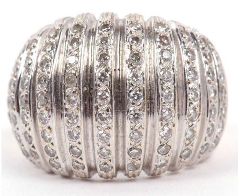 A large diamond cluster cocktail ring of concave shape, featuring eighty seven small single cut diamonds, stamped 750, g/w 17