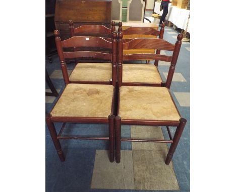 A Set of Four Ladder Back Dining Chairs. 