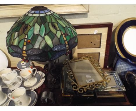 A Tray Containing Various Photo Frames, Reproduction Tiffany Dragonfly Lamp Etc. 