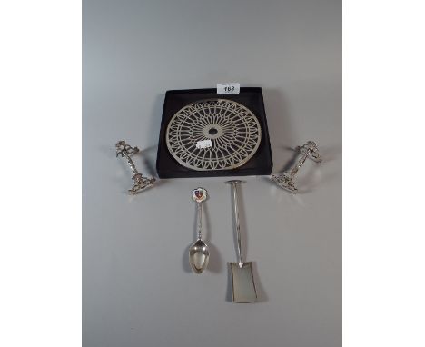 A Silver Teapot Stand, Silver Plated Knife Rest, Silver Spoon and Silver Plated Shovel.