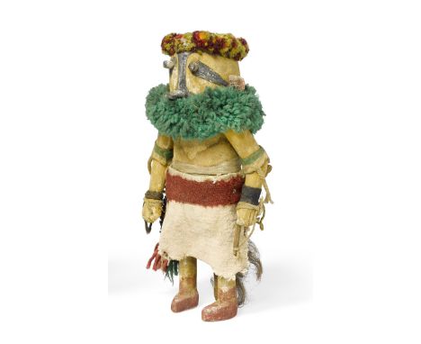 A Zuni katsina dollDepicting Ohapa, the Bee katsina, the swivel arms secured with nails, carrying a bow and wearing yellow bo