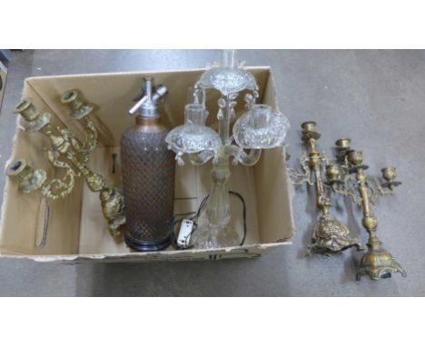 Three metal candelabra and one glass and a soda syphon converted into a lamp **PLEASE NOTE THIS LOT IS NOT ELIGIBLE FOR POSTI