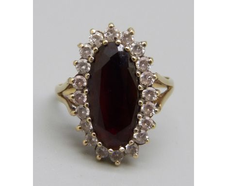 A 9ct gold, garnet and white stone ring, 3.3g, L 