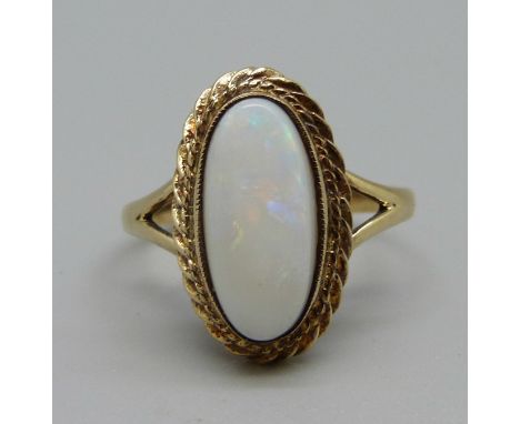 A 9ct gold and opal ring, 3.7g, R 