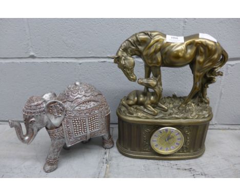 A resin mantle clock depicting a horse and foal and a model of an Indian elephant **PLEASE NOTE THIS LOT IS NOT ELIGIBLE FOR 