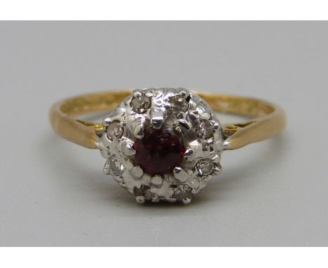 An 18ct gold, garnet and diamond cluster ring, 2.9g, L 