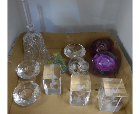 A collection of glass including paperweights including Caithness, a glass bell, etc. 