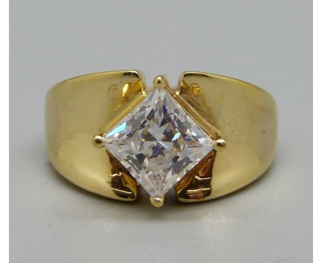 A silver gilt and white stone ring, P 