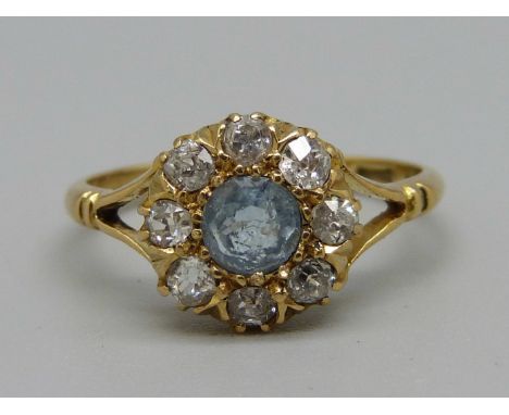 An 18ct gold aquamarine and diamond cluster ring, Birmingham 1918, 2.5g, M 