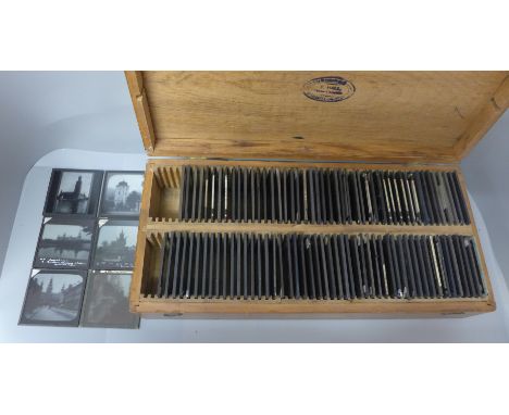 A wooden case with one hundred magic lantern slides 