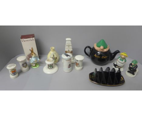 A collection of mixed china including a Wade Andy Capp teapot, toast rack, salt and pepper shakers, Beswick Peter Rabbit and 