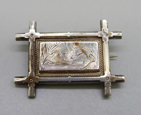 A white metal sweetheart panel brooch with bright cut swallow decoration, c.1880-1900 