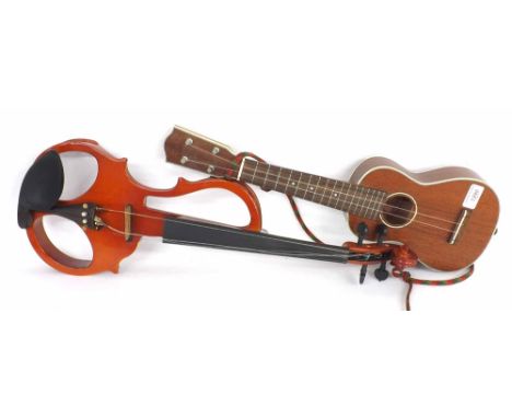 Contemporary Stagg ukulele, soft case; also a contemporary Antoni electric skeleton violin, soft case (2)