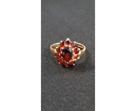 GOLD AND GARNET RING