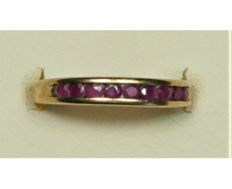 A 9ct gold and ruby channel set ring, L, 1.8gm 