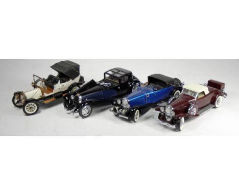 Four Franklin Mint 1:24 scale die cast car models, to include a 1933 Bugatti Royale Coupe Napoleon, a 1913 Ford Model T, a 19