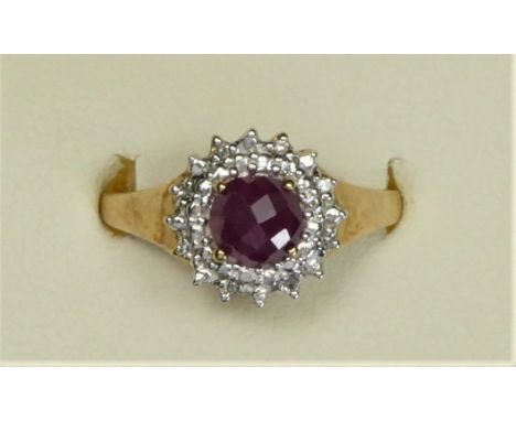 A 9ct gold ruby and diamond cluster ring, P, 2.9gm 