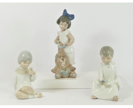 A Nao by Lladro figurine of My Lovely Lion 25cm together with two Spanish figurines of children, 15 and 17cm, together with T