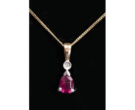 A 9ct gold pear shape ruby and diamond pendant, chain, 0.8gm 