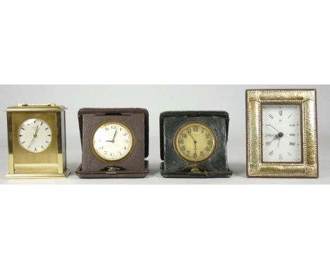 A French gilt brass 8 day carriage/alarm clock, together with two manual wind traveling alarm clocks and a silver framed quar