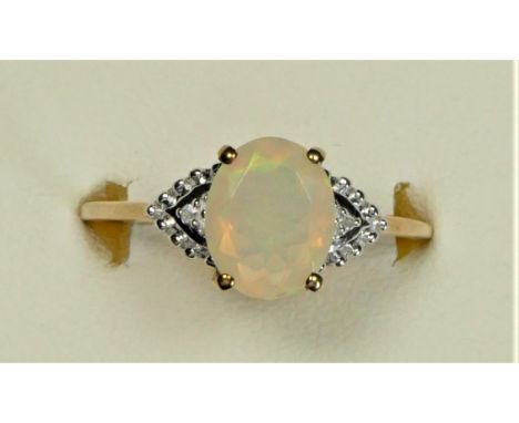 A 9ct gold facetted opal and diamond dress ring, 10 x 8mm, U, 2.2gm 