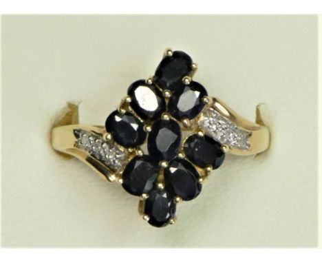 A 9ct gold sapphire and diamond dress ring, P, 3.3gm, box 