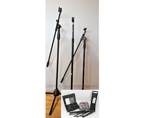 A Behringer Ultravoice XM8500 microphone, carry case with fitted foam interior, together with three Behringer Ultravoice XM18