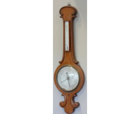 A late 19th Century banjo mercury barometer, mahogany carved leaf scroll case, silvered dial, encased mercury thermometer, wi