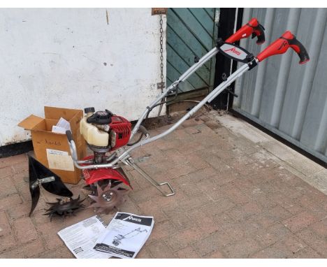 A Mantis Deluxe 4 stroke Tiller, model 7265, with Honda GX25 engine, instructions and spare attachments 
