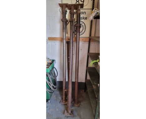 Three Acro 170cm props, together with a clamp 