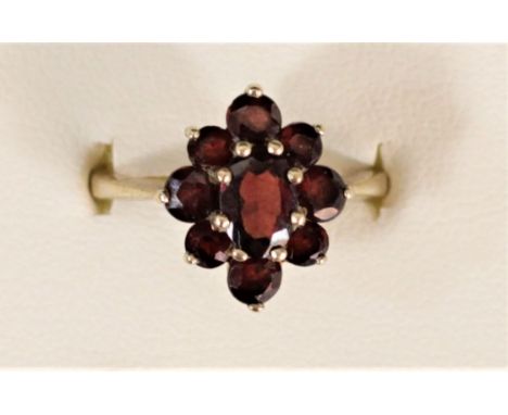 A 9ct gold and garnet cluster ring, M, 2.9gm 