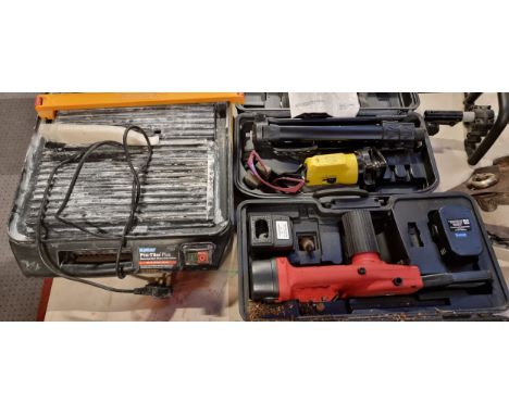 A Inventek self adjusting laser level (boxed) together with a Plasplugs tile cutter and a cordless chainsaw. boxed. (3) 