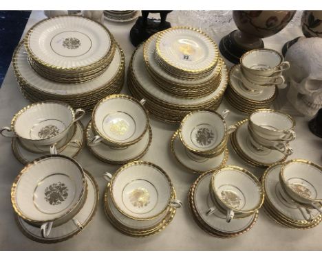 A Paragon white and gilt tea/ dinner service