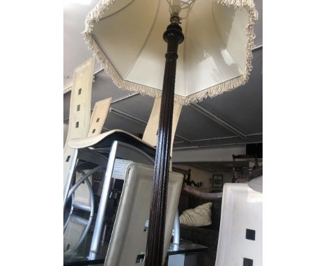 A mahogany standard lamp, with shade