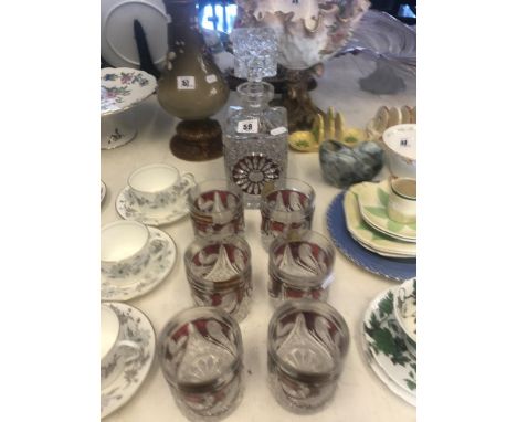 A ruby decanter and six tumblers