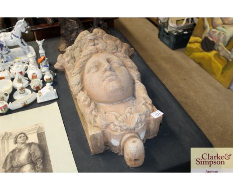 A pottery garden hanging planter in the form of a lady's head