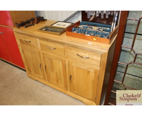 A modern light wood sideboard by Oak Furniture Land 