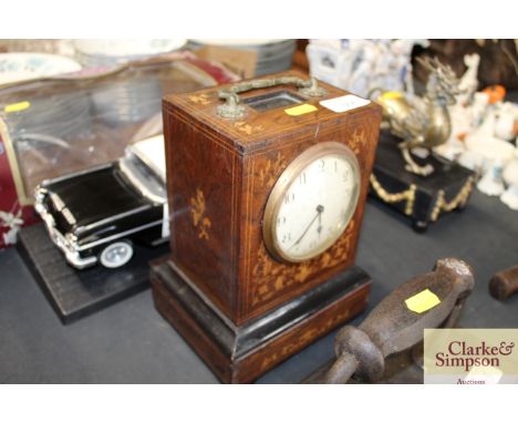 An inlaid rosewood mantel clock 