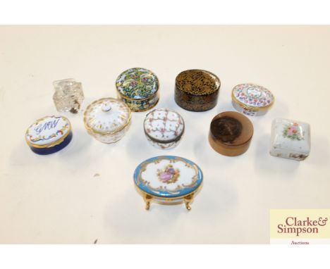 A collection of various porcelain and enamel patch boxes 